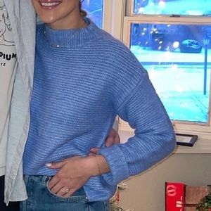 Blue sweater with cuffed sleeves
